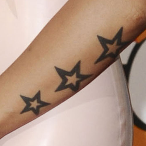 Nice Black Outline Star Tattoo On Arm