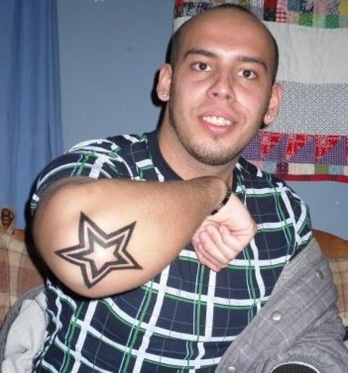 Outline Black Star Tattoos On Elbow For Men