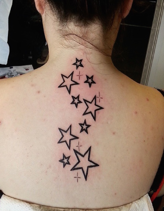 Outline Black Star Tattoos On Girl Upper Back