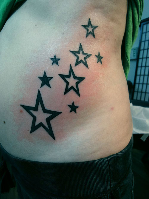Outline Black Star Tattoos On Side Rib