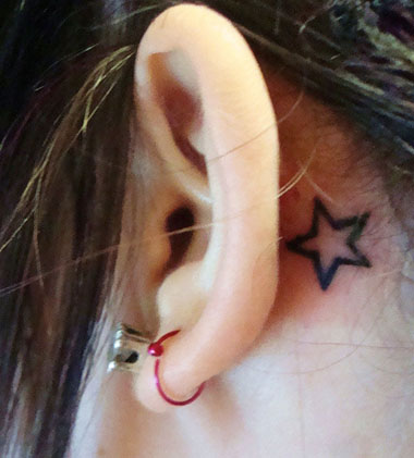 Outline Small Star Tattoo Behind The Ear