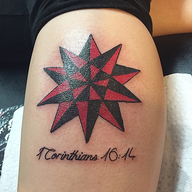 Red And Black Star Tattoo On Side Leg