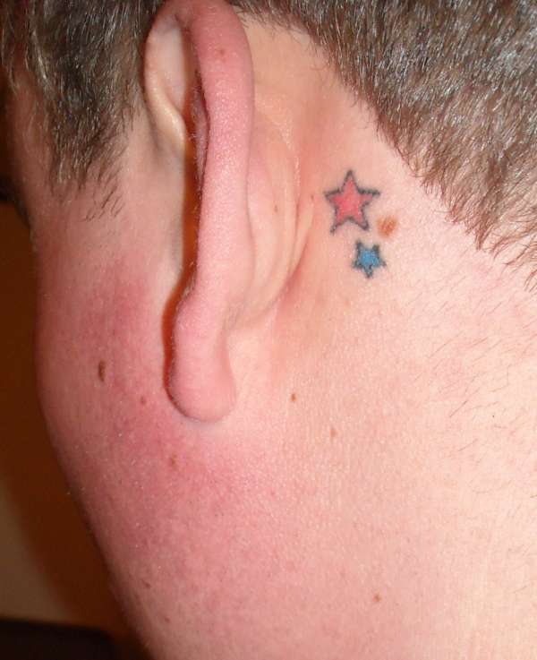 Red And Blue Star Tattoos Behind The Ear