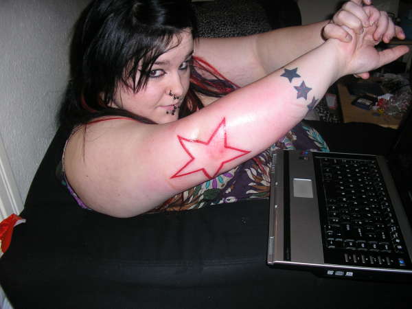 Red Outline Star Tattoo On Elbow For Women