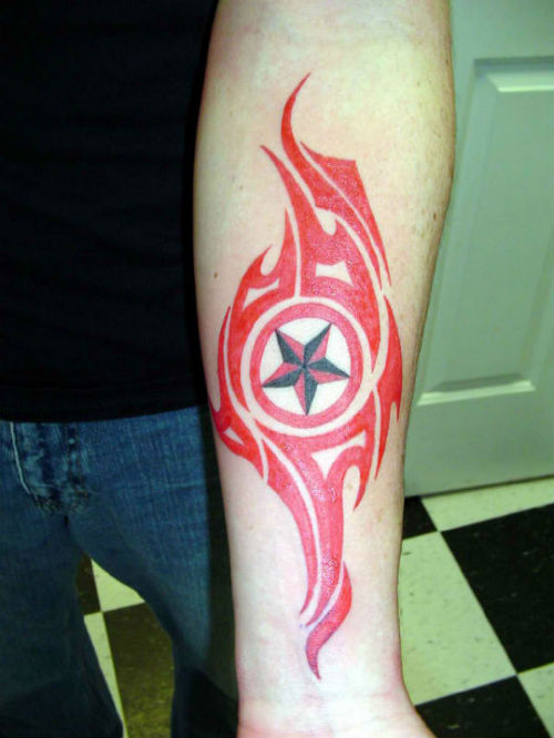 Red Tribal And Nautical Star Tattoo On Left Forearm