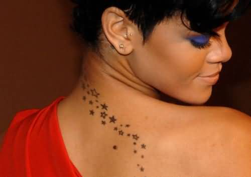 Rihanna With Small Star Tattoos On Upper Back