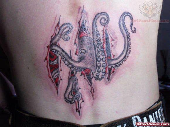 Ripped Skin Octopus Tattoo On Lower Back