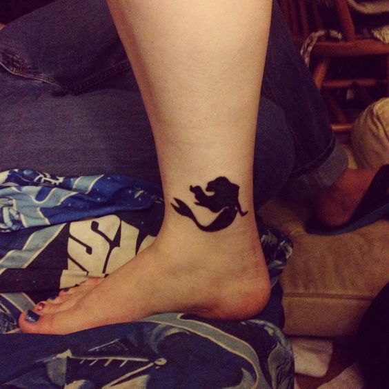 Silhouette Mermaid Tattoo On Girl Right Foot Ankle