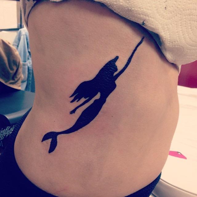 Silhouette Mermaid Tattoo On Girl Right Side Rib