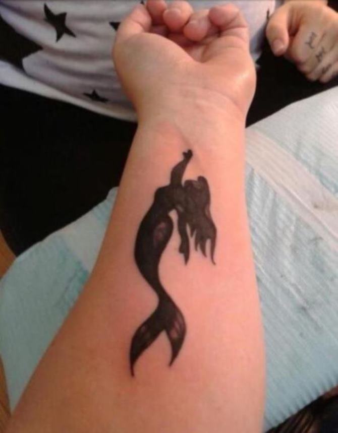 Silhouette Mermaid Tattoo On Left Forearm
