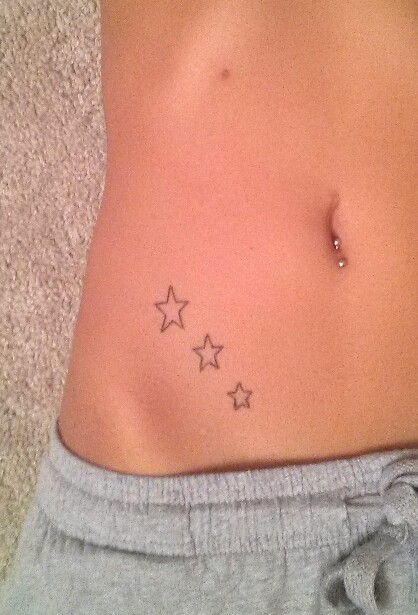 Silver Barbell Belly Piercing And Star Tattoos On Hip