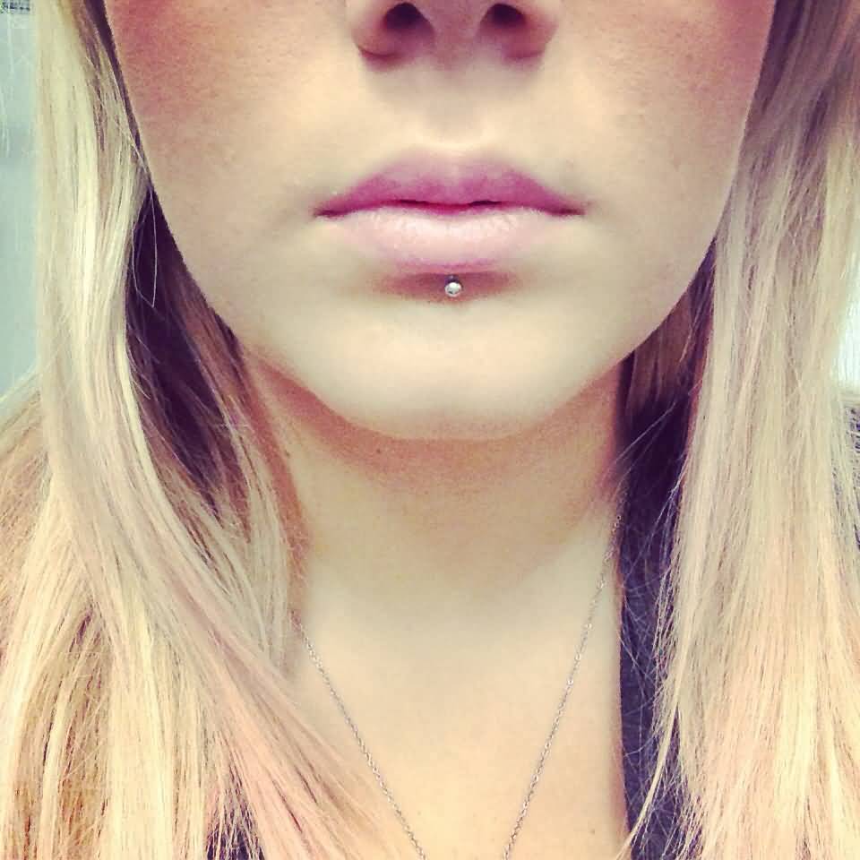 Silver Stud Labret Tattoo On Lower Lip