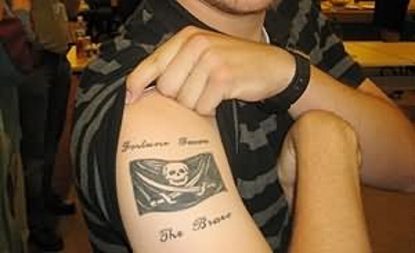 Simple Black Ink Pirate Flag Tattoo On Man Right Shoulder