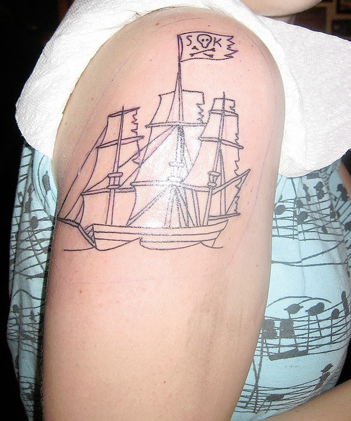 Simple Black Outline Pirate Ship Tattoo On Right Shoulder