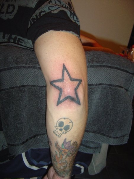 Small Skull And Outline Star Tattoo On Elbow