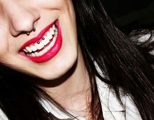 Smiling Girl With Septum And Smiley Piercing