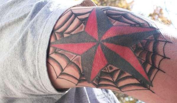 Spider Web And Nautical Star Tattoo On Elbow