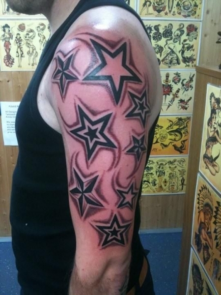 Star Tattoo On Man Left Half Sleeve