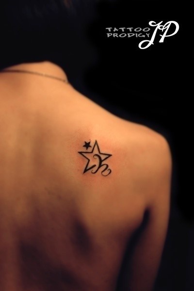 Star Tattoo On Right Back Shoulder