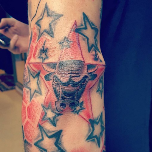 Taurus Sign And Star Tattoos On Elbow
