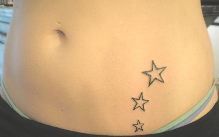Three Outline Star Tattoos On Hips