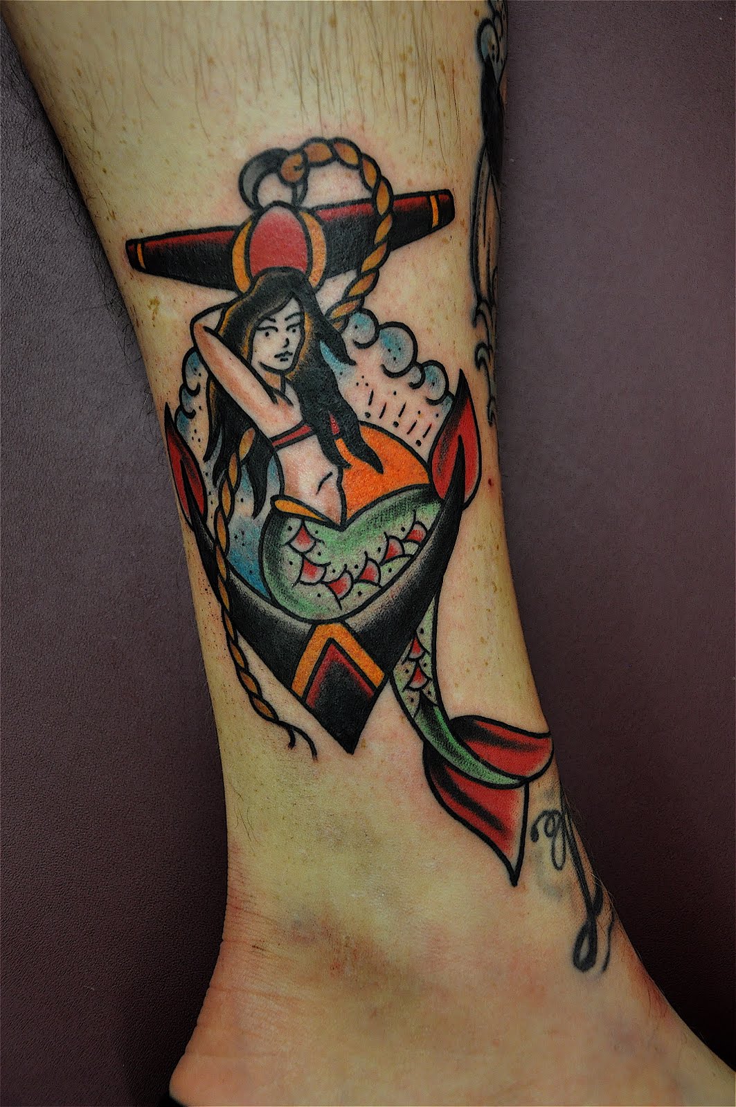 Traditional Colorful Mermaid With Anchor Tattoo On Right Leg