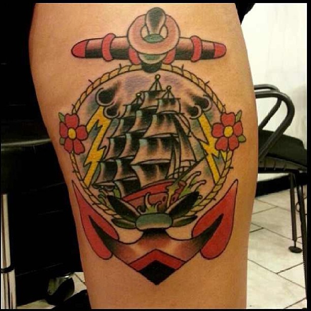 Traditional Cool Pirate Ship In Anchor Frame Tattoo Design For Thigh