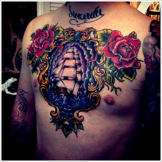 Traditional Pirate Ship In Frame With Roses Tattoo On Man Chest