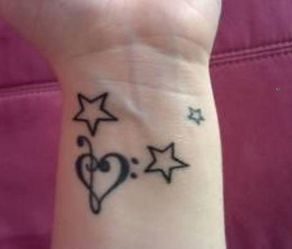 Treble Heart And Star Tattoos On Wrist