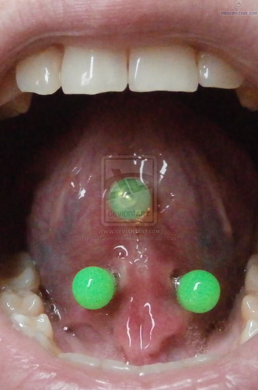 Webbing Piercing With Green Barbell