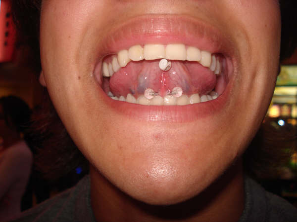Webbing Piercing With White Barbell
