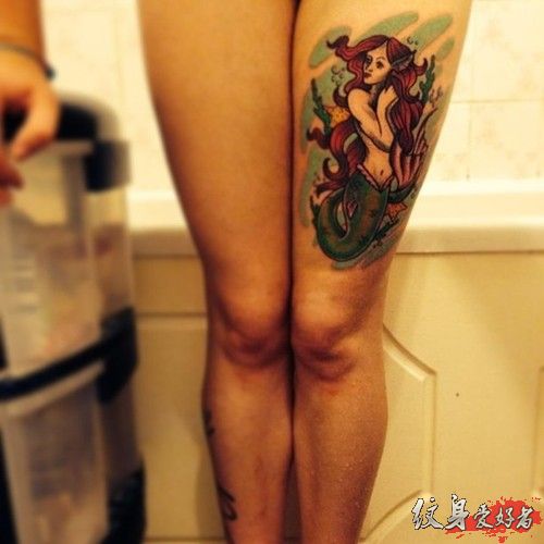 Wonderful Mermaid Tattoo On Girl Left Thigh