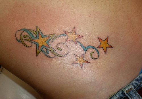 Yellow Star Tattoos On Hip