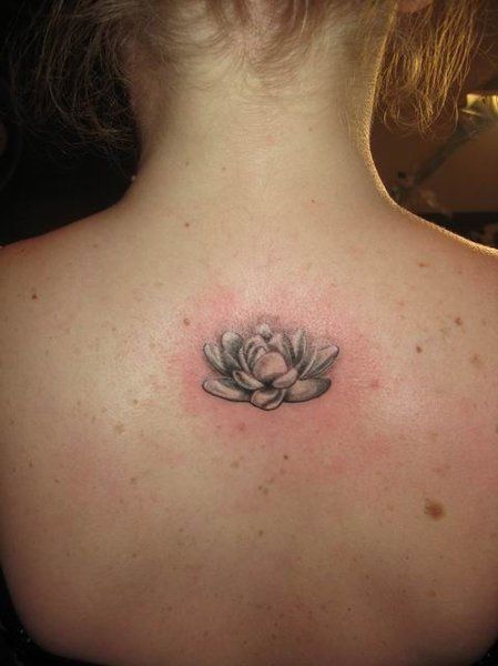Awesome Black And White Lotus Tattoo On Girl Upper Back