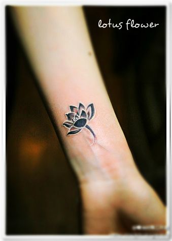 Black And White Lotus Tattoo On Left Wrist