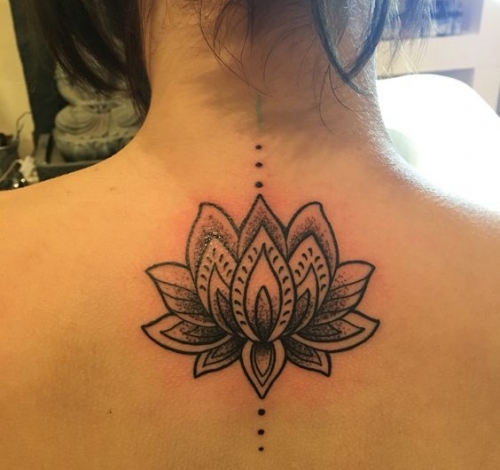 Black Ink Lotus Flower Tattoo On Girl Upper Back