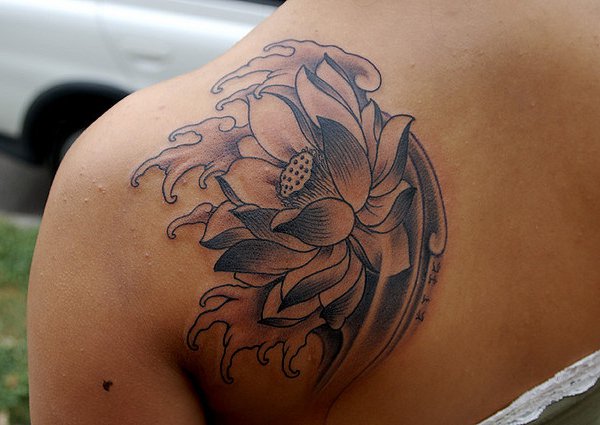 Black Ink Lotus Flower Tattoo On Left Back Shoulder