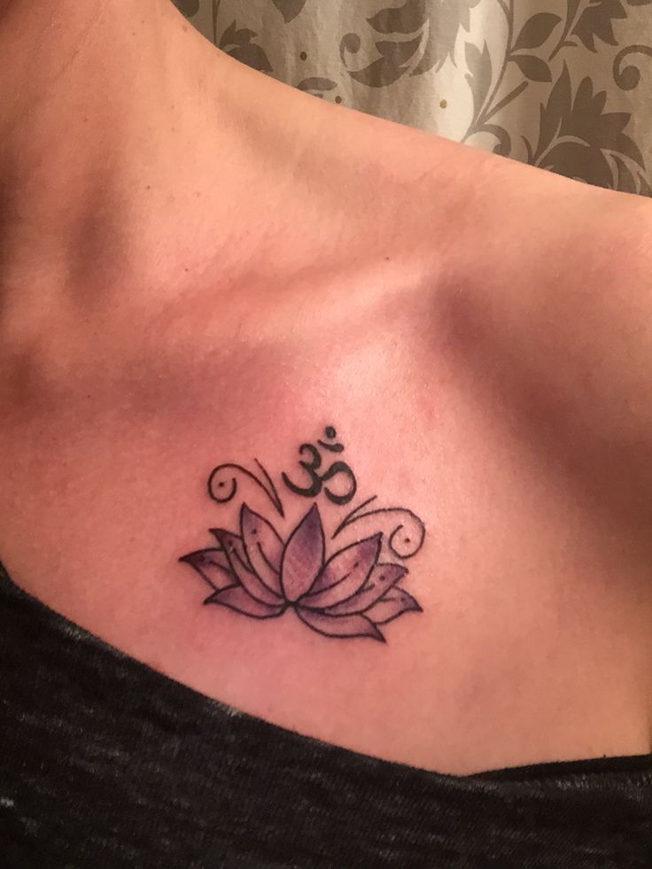 Black Ink Lotus Flower With Om Tattoo On Left Front Shoulder