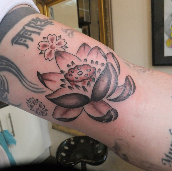 Classic Black Ink Lotus Flower Tattoo Design For Bicep