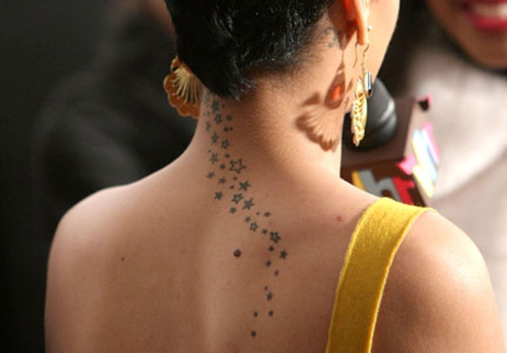Nice Small Star Tattoos On Girl Back Neck