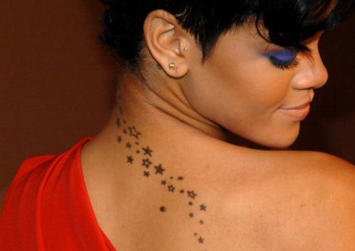 Rihanna With Star Tattoos On Back Neck