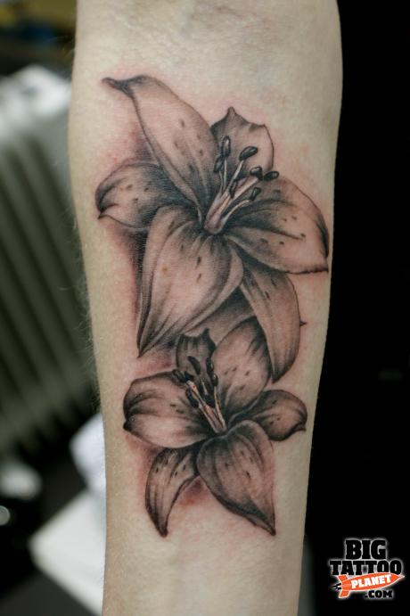 Amazing Black And Grey Lily Tattoo On Forearm