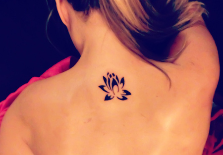 Amazing Black Ink Lotus Flower Tattoo On Girl Back Neck