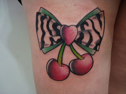 Amazing Bow And Cherry Tattoo On Girl Thigh