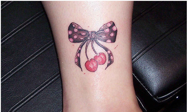 Amazing Bow And Cherry Tattoo On Leg