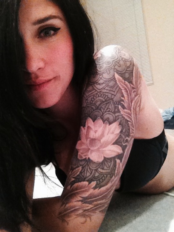 Attractive Black And White Lotus Flower Tattoo On Girl Left Half Sleeve