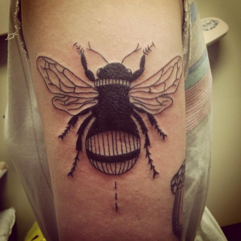 Attractive Black Bumblebee Tattoo On Half Sleeve