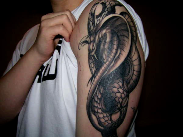 Attractive Black Ink Cobra Snake Tattoo On Left Half Sleeve
