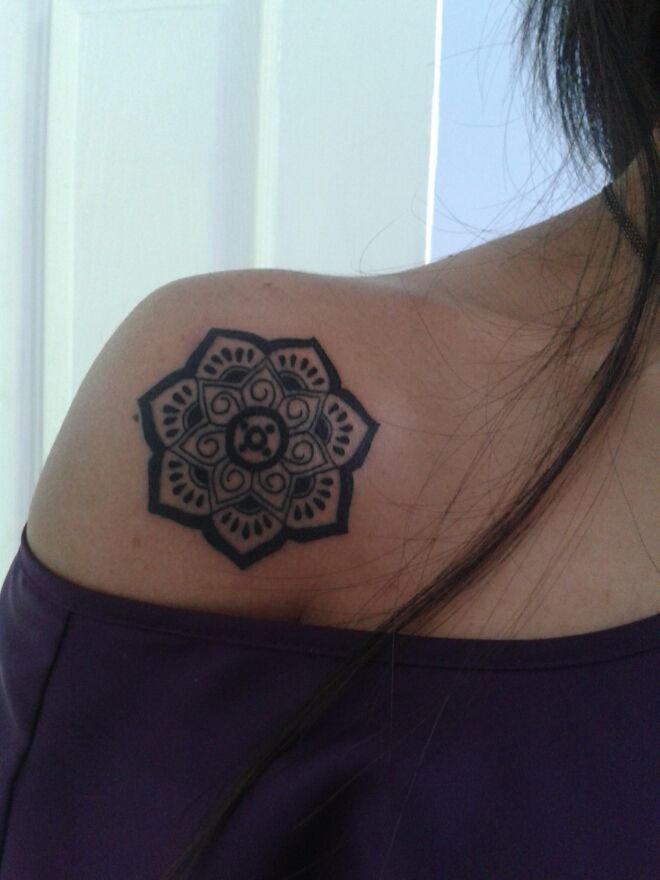 Attractive Black Ink Lotus Tattoo On Shoulder