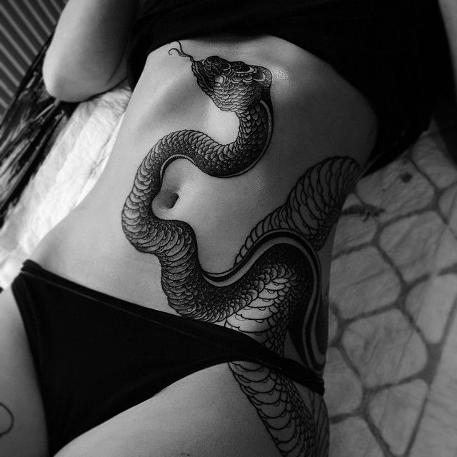 Attractive Black Ink Snake Tattoo On Girl Stomach